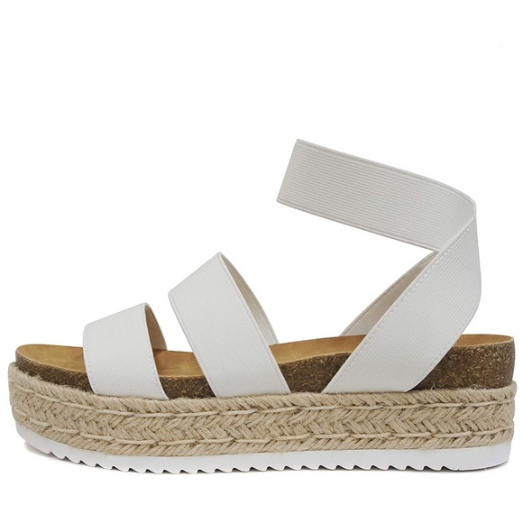 white elastic sandals